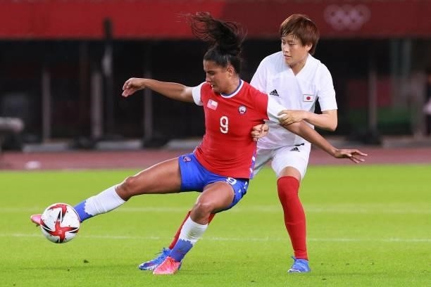 Chile's forward Maria Jose Urrutia fights for the ball with Japan's defender Saori Takarada during the Tokyo 2020 Olympic Games women's group E first...