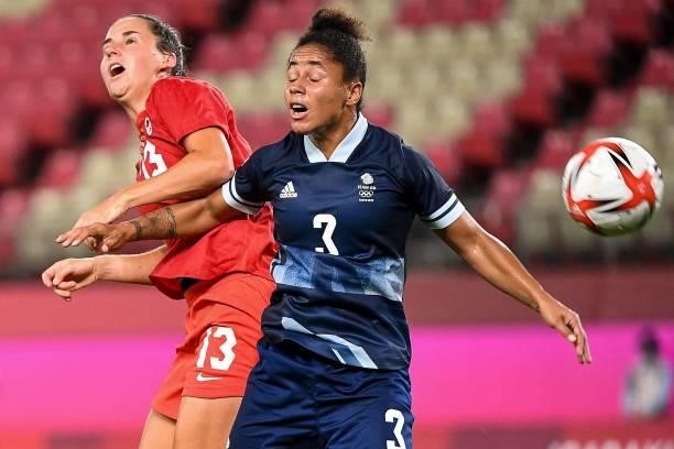 Canada's forward Evelyne Viens fights for the ball with Britain's defender Demi Stokes during the Tokyo 2020 Olympic Games women's group E first...
