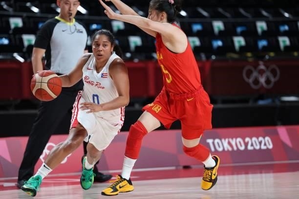 Puerto Rico's Jennifer O'neill dribbles the ball past China's Wang Siyu in the women's preliminary round group C basketball match between China and...