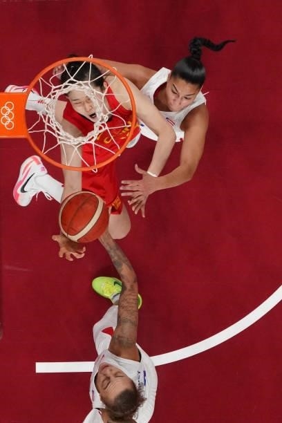 China's Sun Mengran goes to the basket past Puerto Rico's Tayra Melendez in the women's preliminary round group C basketball match between China and...