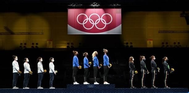 Gold medallist Estonia's team fencers , South Korea's team fencers silver medallist and Italy's team fencers bronze medallist listen the national...