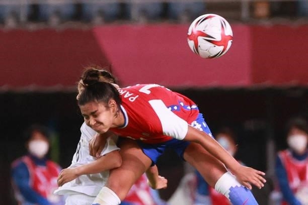 Japan's midfielder Narumi Miura fights for the ball with Chile's defender Daniela Pardo during the Tokyo 2020 Olympic Games women's group E first...