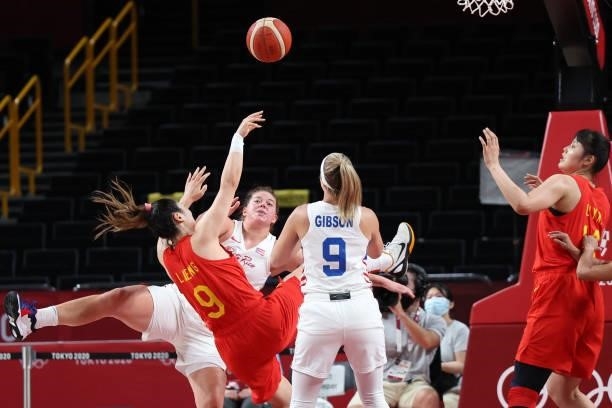 China's Li Meng takes a shot past Puerto Rico's Ali Gibson in the women's preliminary round group C basketball match between China and Puerto Rico...