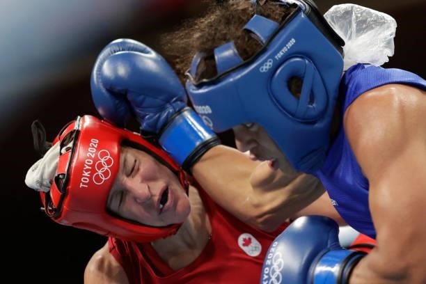 Canada's Myriam Da Silva and Dominican Republic's Maria Altagracia Moronta Hernandez fight during their women's welter preliminaries round of 16...