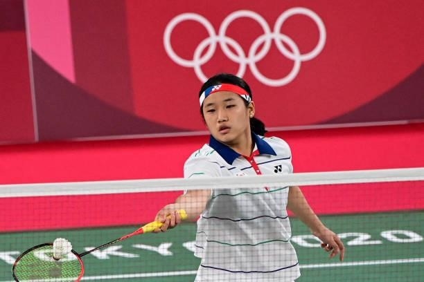 South Korea's An Se-young hits a shot against Nigeria's Dorcas Ajoke Adesokan in their women's singles badminton group stage match during the Tokyo...