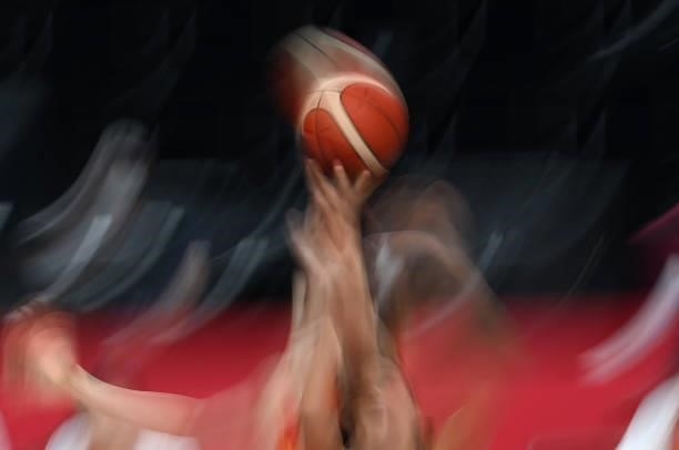 Puerto Rico's and Chinese players jump for the ball in the women's preliminary round group C basketball match between China and Puerto Rico during...
