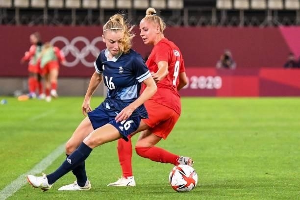 Britain's defender Leah Williamson fights for the ball with Canada's forward Adriana Leon during the Tokyo 2020 Olympic Games women's group E first...