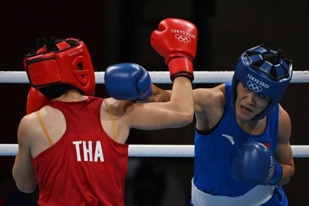 Thailand's Baison Manikon China's Gu Hong fight during their women's welter preliminaries round of 16 boxing match during the Tokyo 2020 Olympic...