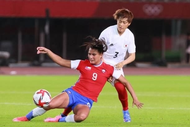 Chile's forward Maria Jose Urrutia fights for the ball with Japan's defender Saori Takarada during the Tokyo 2020 Olympic Games women's group E first...