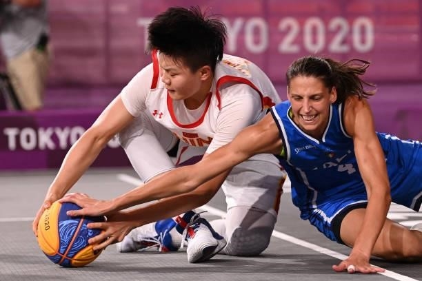 China's Wan Jiyuan fights for the ball with Italy's Chiara Consolini during the women's quarter final 3x3 basketball match between China and Italy at...