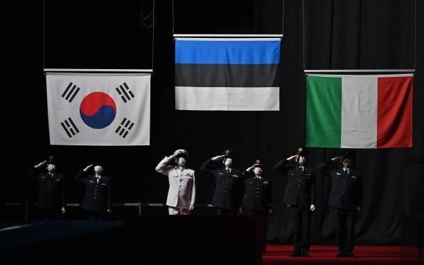 The national flag of South Korea, Estonia and Italy are raised during the medal ceremony for the womens team epee during the Tokyo 2020 Olympic Games...