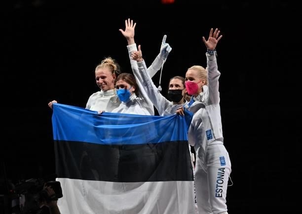 Estonia's fencers celebrate after winning against South Korea's in the womens team epee gold medal bout during the Tokyo 2020 Olympic Games at the...
