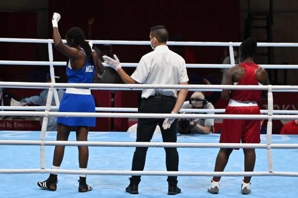Mozambique's Acinda Helena Panguana celebrates after winning by KO against Kenya's Elizabeth Akinyi at the end of their women's welter preliminaries...