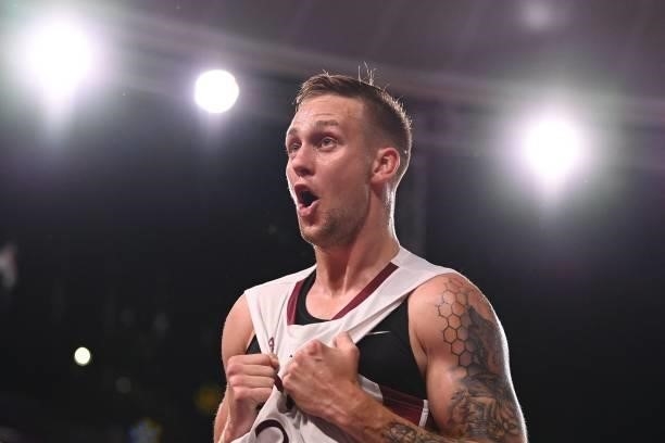 Latvia's Karlis Lasmanis celebrates after wining at the end of the men's quarter final 3x3 basketball match between Latvia and Japan at the Aomi...