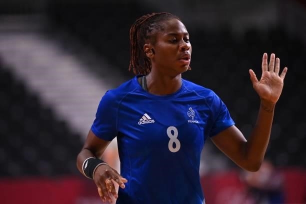 France's left wing Coralie Lassource celebrates after scoring during the women's preliminary round group B handball match between France and Spain of...