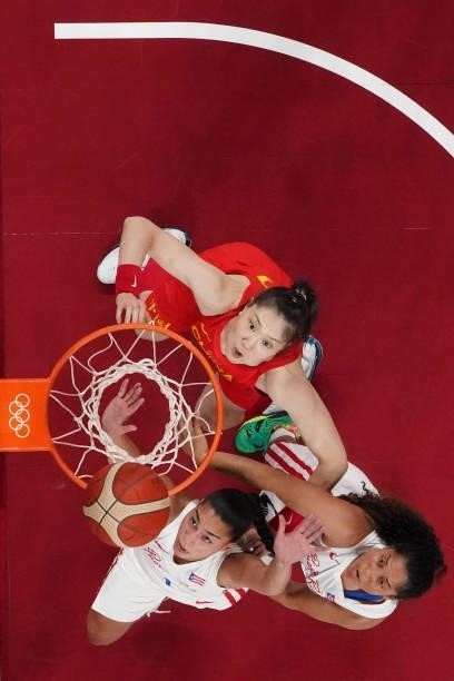 Puerto Rico's Tayra Melendez jumps for a rebound during the women's preliminary round group C basketball match between China and Puerto Rico of the...