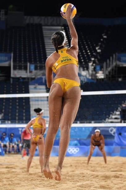 Brazil's Eduarda Santos Lisboa serves the ball during their women's preliminary beach volleyball pool C match between Brazil and China during the...