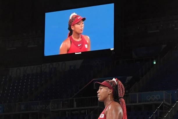 Japan's Naomi Osaka competes against Czech Republic's Marketa Vondrousova during their Tokyo 2020 Olympic Games women's singles third round tennis...