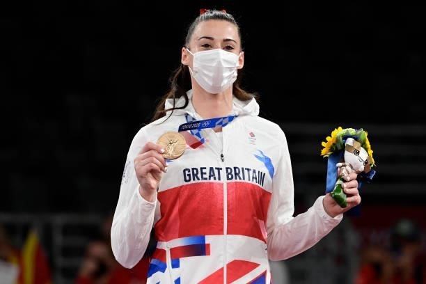 Bronze medalist Britain's Bianca Walkden poses on the podium after the taekwondo women's +67kg bronze medal A bout during the Tokyo 2020 Olympic...