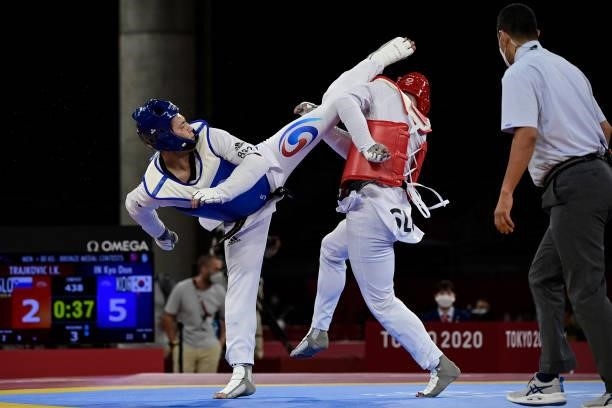 South Korea's In Kyo-don and Slovenia's Ivan Konrad Trajkovic compete in the taekwondo men's +80kg bronze medal A bout during the Tokyo 2020 Olympic...