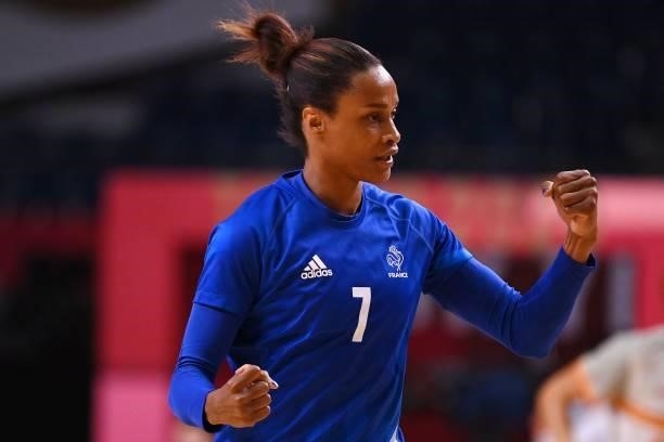 France's left wing Allison Pineau celebrates after scoring during the women's preliminary round group B handball match between France and Spain of...