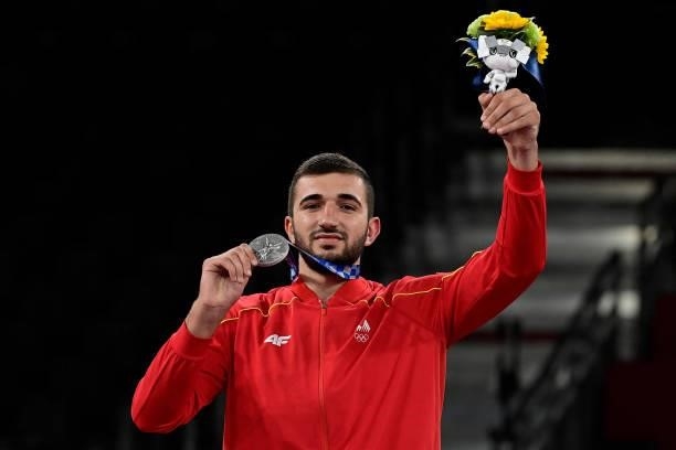 Silver medalist North Macedonia's Dejan Georgievski poses on the podium after the the taekwondo men's +80kg medal bouts during the Tokyo 2020 Olympic...