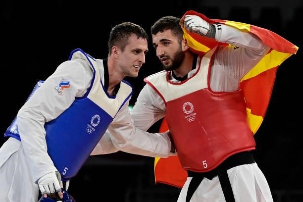 Russia's Vladislav Larin and North Macedonia's Dejan Georgievski react after the taekwondo men's +80kg gold medal bout during the Tokyo 2020 Olympic...