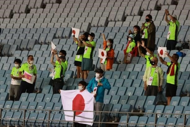 Japanese fans celebrate after Japan won the Tokyo 2020 Olympic Games women's group E first round football match between Chile and Japan at the Miyagi...