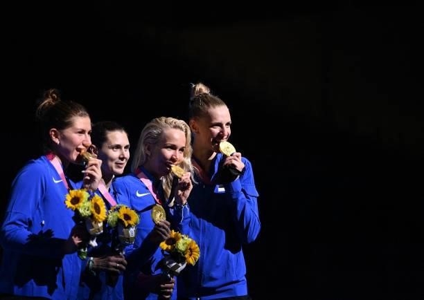 Gold medallist Estonia's fencers celebrate during the medal ceremony for the womens team epee during the Tokyo 2020 Olympic Games at the Makuhari...