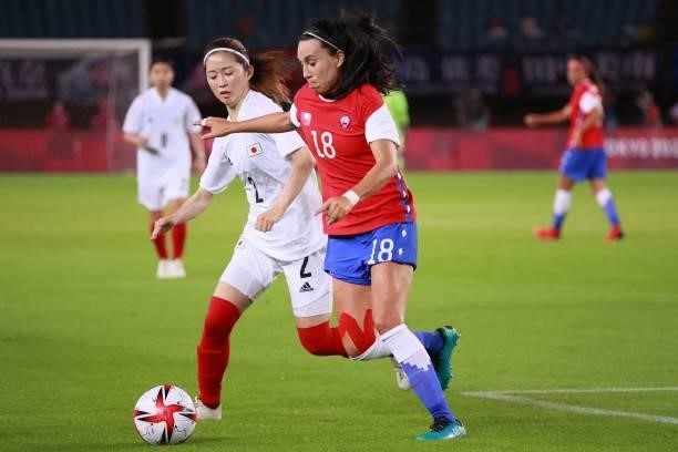 Japan's defender Risa Shimizu fights for the ball with Chile's defender Camila Saez during the Tokyo 2020 Olympic Games women's group E first round...