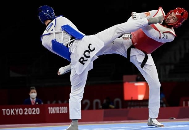 Russia's Vladislav Larin and North Macedonia's Dejan Georgievski compete in the taekwondo men's +80kg gold medal bout during the Tokyo 2020 Olympic...