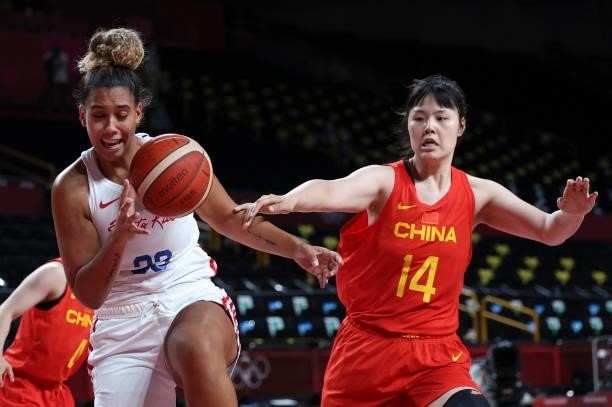 Puerto Rico's India Pagan reacts next to China's Li Yueru in the women's preliminary round group C basketball match between China and Puerto Rico...
