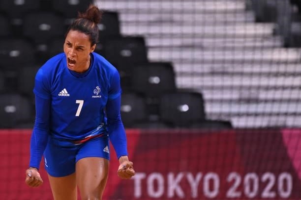France's left wing Allison Pineau celebrates after scoring during the women's preliminary round group B handball match between France and Spain of...