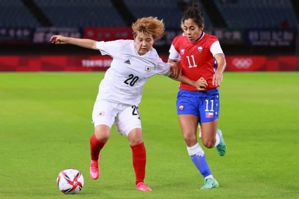 Japan's midfielder Honoka Hayashi fights for the ball with Chile's midfielder Yessenia Lopez during the Tokyo 2020 Olympic Games women's group E...