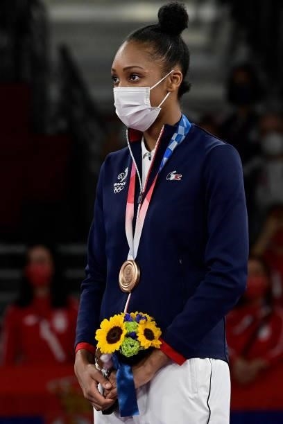 Bronze medalist France's Althea Laurin poses on the podium after the taekwondo women's +67kg bronze medal A bout during the Tokyo 2020 Olympic Games...