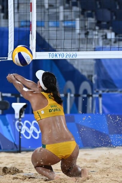 Brazil's Eduarda Santos Lisboa plays a shot during their women's preliminary beach volleyball pool C match between Brazil and China during the Tokyo...