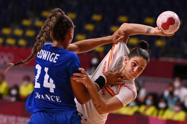 Spain's centre back Alicia Fernandez Fraga is challenged during the women's preliminary round group B handball match between France and Spain of the...