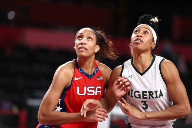 Ja Wilson of the USA Basketball Womens National Team and Pallas Kunaiyi-Akpanah of the Nigeria Womens National Team look up for the rebound during...