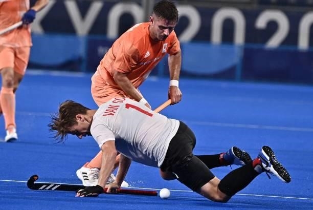 Canada's Floris Frederik Van Son and Netherlands' Robbert Kemperman vie for the ball during their men's pool B match of the Tokyo 2020 Olympic Games...