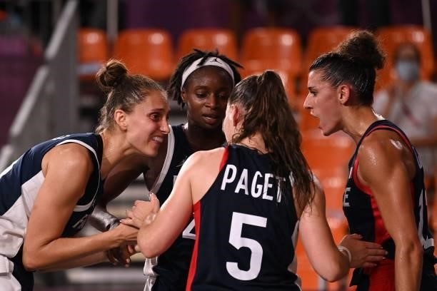 France's teammates celebrate after wining at the end of the women's quarter final 3x3 basketball match between Japan and France at the Aomi Urban...