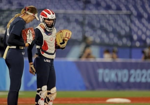 S pitcher Monica Abbott listens to catcher Aubree Munro during the sixth inning of the Tokyo 2020 Olympic Games softball gold medal game between...
