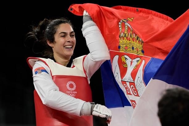 Serbia's Milica Mandic celebrates after winning the taekwondo women's +67kg gold medal bout during the Tokyo 2020 Olympic Games at the Makuhari Messe...
