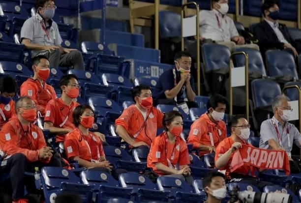 Japan's softball team supporters watch the Tokyo 2020 Olympic Games softball gold medal game between Japan and USA at the Yokohama Baseball Stadium...
