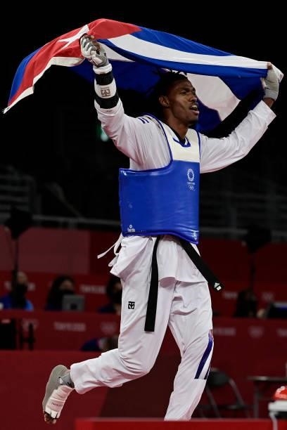 Cuba's Rafael Yunier Alba Castillo celebrates after winning the taekwondo men's +80kg bronze medal B bout during the Tokyo 2020 Olympic Games at the...