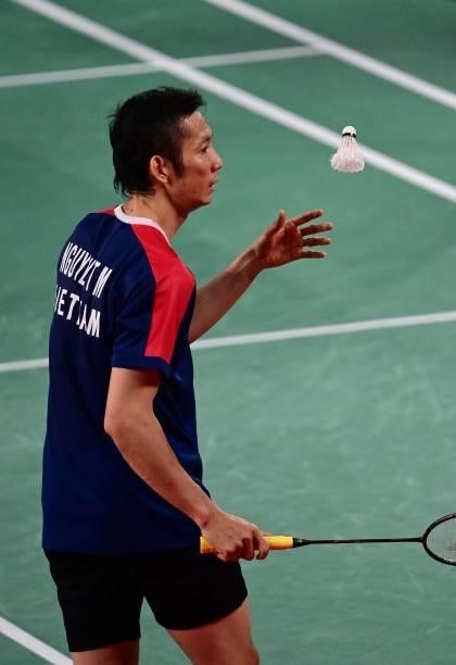 Vietnam's Thuy Linh Nguyen prepares between points with Azerbaijan's Ade Resky Dwicahyo in their men's singles badminton group stage match during the...