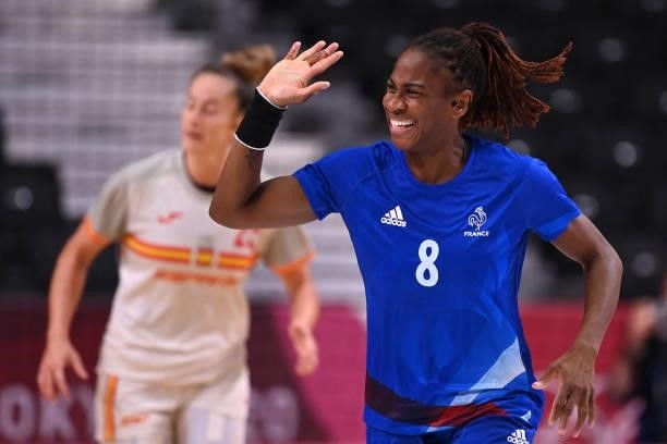 France's left wing Coralie Lassource celebrates after scoring during the women's preliminary round group B handball match between France and Spain of...