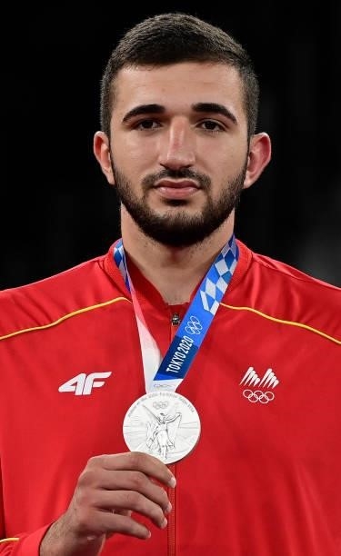 Silver medalist North Macedonia's Dejan Georgievski poses on the podium after the the taekwondo men's +80kg medal bouts during the Tokyo 2020 Olympic...