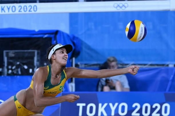Brazil's Eduarda Santos Lisboa reaches fot the ball in their women's preliminary beach volleyball pool C match between Brazil and China during the...