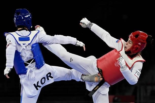 South Korea's Lee Da-bin and Serbia's Milica Mandic compete in the taekwondo women's +67kg gold medal bout during the Tokyo 2020 Olympic Games at the...