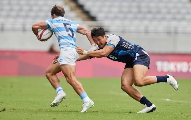 Rodrigo Etchart of Argentina and Seongmin Jang of Korea battle for the ball during the Rugby Pool A match between Argentina and Republic of Korea on...